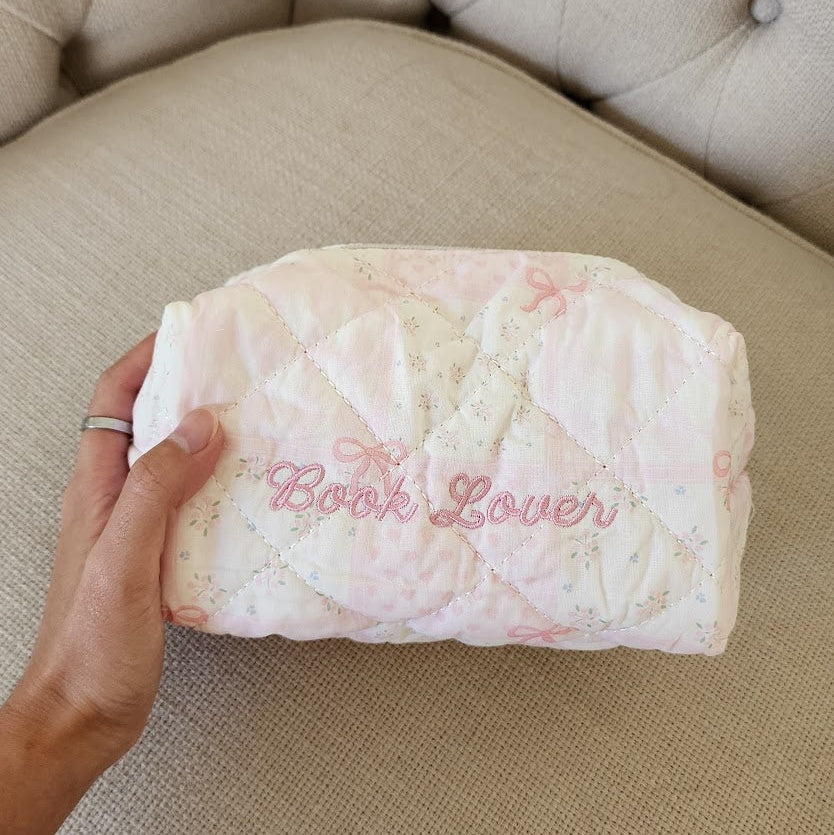 Book Lover Embroidered Quilted Cotton Makeup Bag | Bookish Pouch for Readers - The Bean Workshop - book girlie, bookish gift, bookish pouch, bow, coquette, coquette gift, embroidered makeup bag, gift for book lovers, kindle bag, makeup bag, quilted makeup bag, quilted pouch, read everyday, reading accessories, reading accessories bag