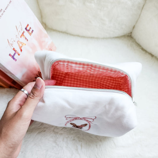 Little Rabbit and Her Book Zippered Pouch | Bookish Makeup & Reading Accessories Bag - The Bean Workshop - book girlie, bookish gift, bookish pouch, bow, coquette, coquette aesthetic, embroidered pouch, gift for book lovers, kindle bag, makeup bag, quilted pouch, rabbit book bag, reading accessories, reading accessories bag, zipper pouch