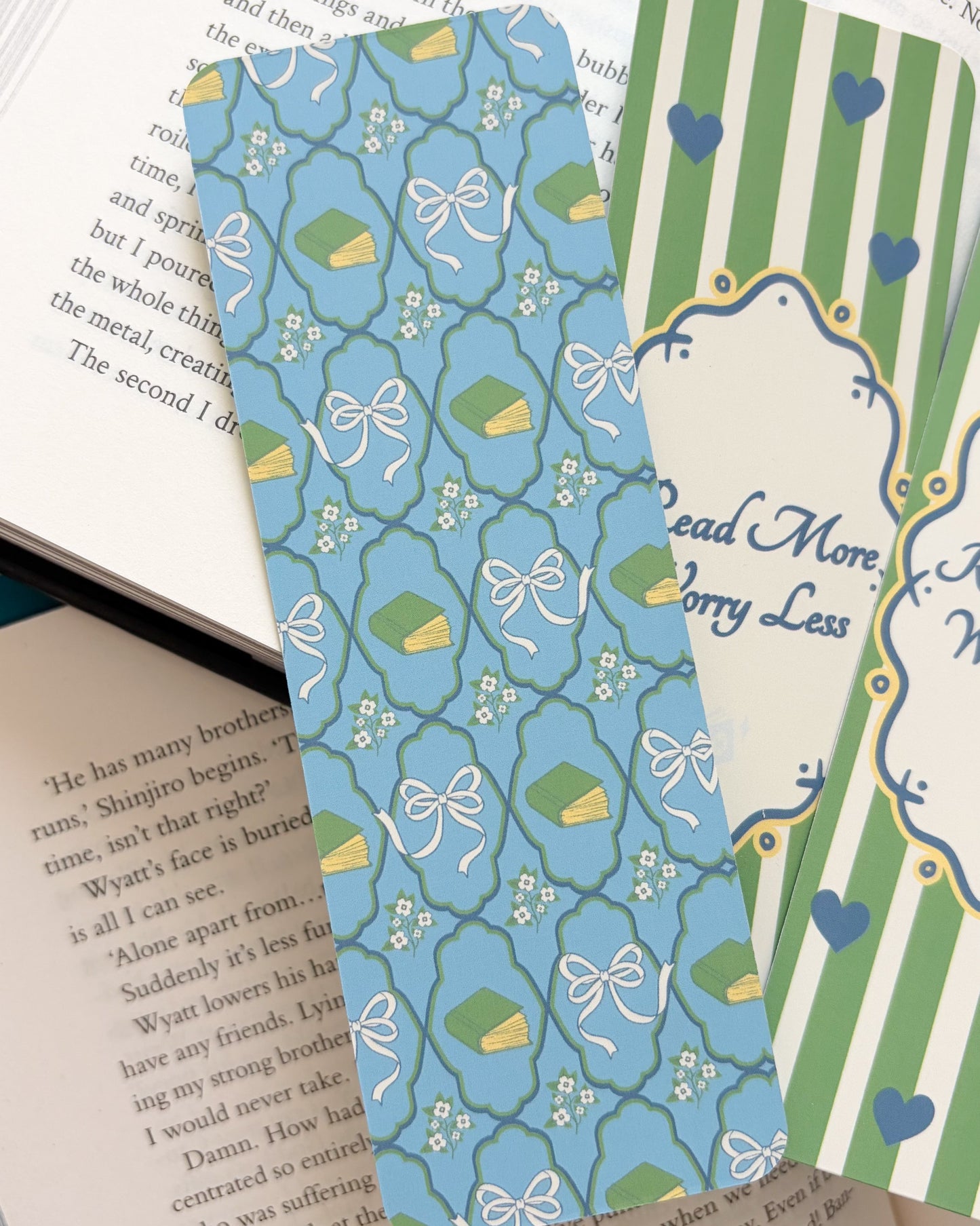 Two bookmarks with decorative patterns on an open book