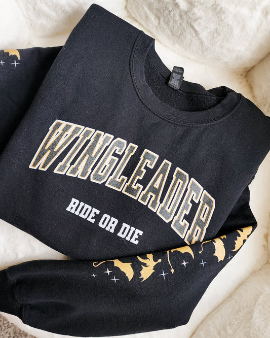 Black WINGLEADER Ride or Die sweatshirt with dragon and star designs on sleeve, bookish merch