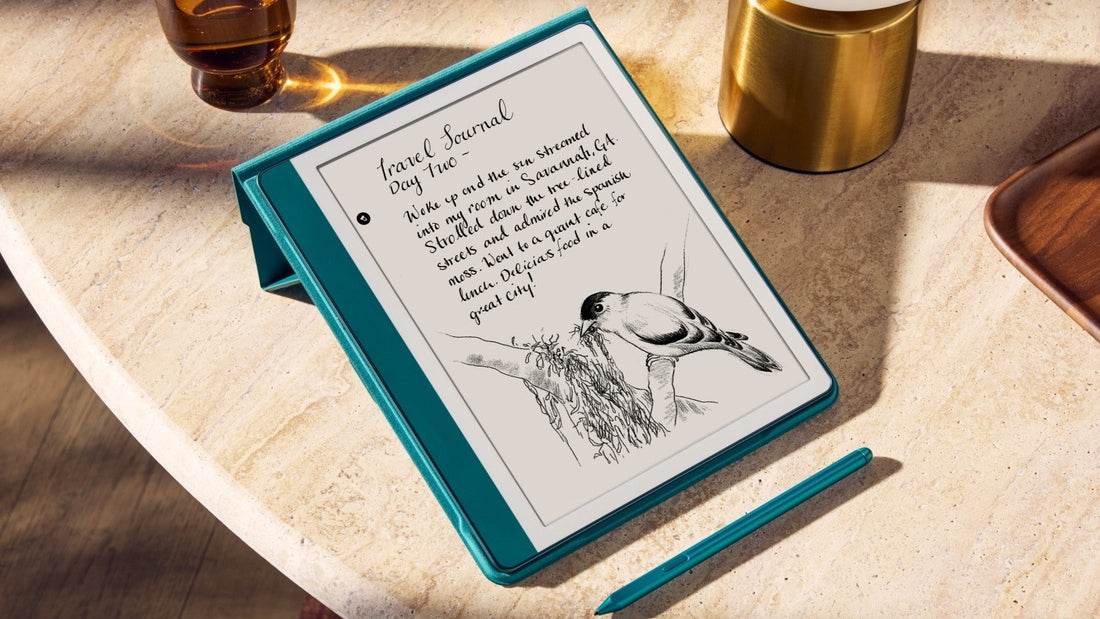 Kindle tablet on a desk displaying a handwritten travel journal with bird sketch, stylus nearby.