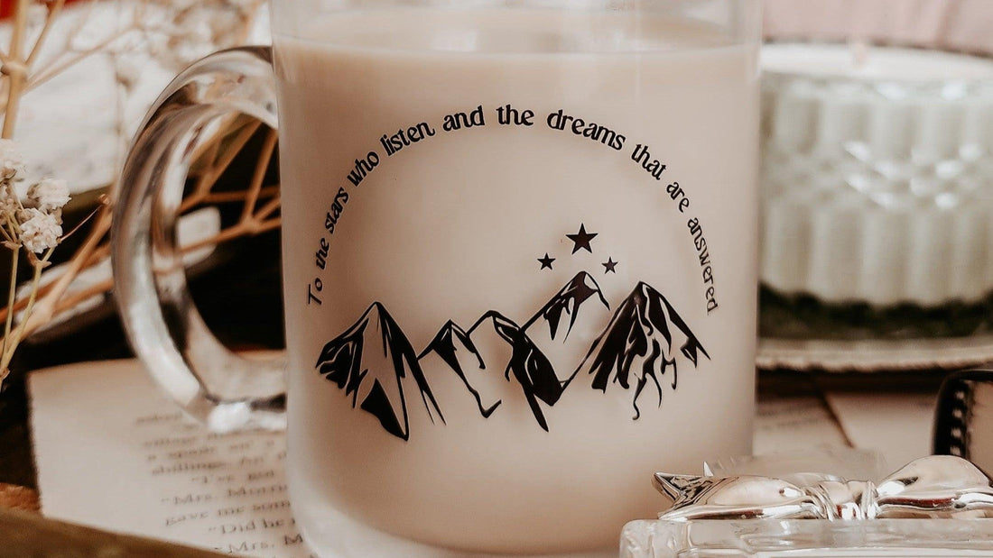 Frosted glass mug with mountain and stars design, A Court of Thorns and Roses quote, cozy setting