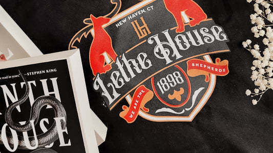Lethe House organic cotton bookish tote bag with crest design, Ninth House novel, and flowers