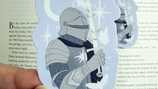 Knight in armor holding sword with stars and moon, bookish merchandise for fantasy lovers