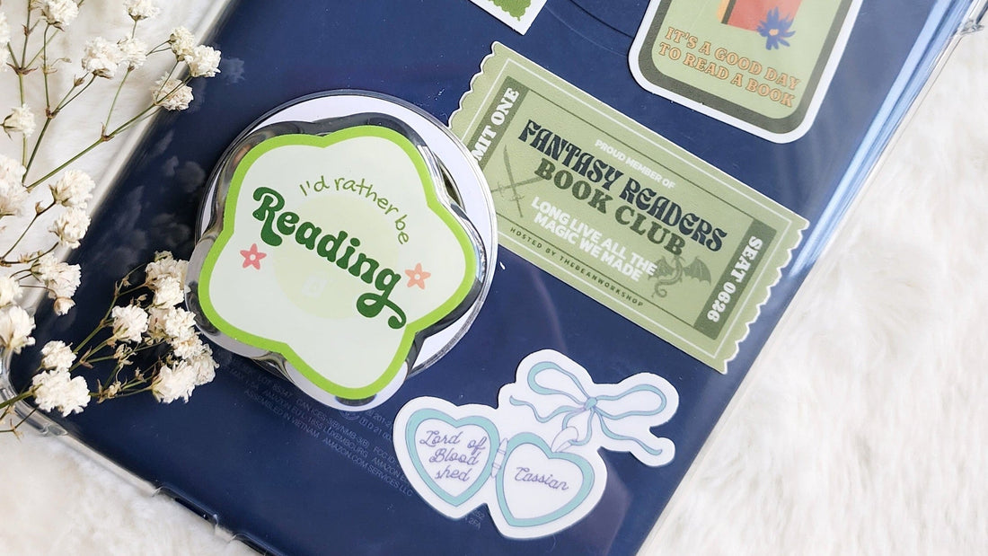 Bookish magnetic Kindle grip with 'I'd rather be reading' text, surrounded by reading-themed stickers