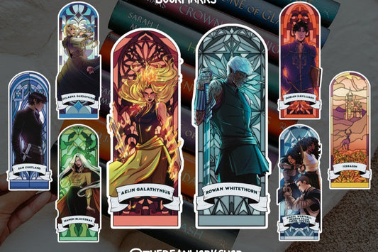 Throne of Glass character bookmarks with colorful stained glass designs on stacked books