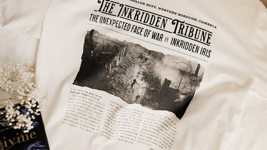 White t-shirt featuring vintage newspaper style text and a monochrome war scene illustration.