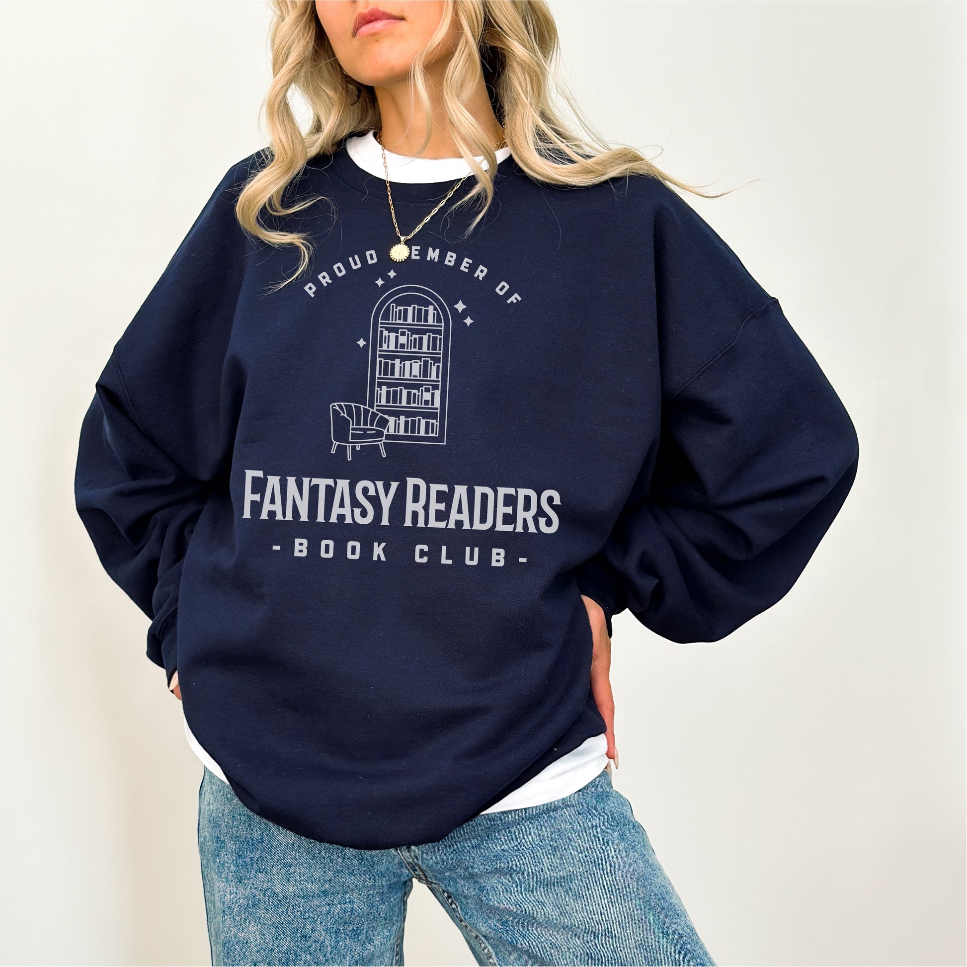Navy blue Fantasy Readers Book Club sweater with bookshelf and chair graphic