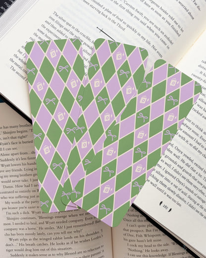 Green and purple patterned bookmark on an open book