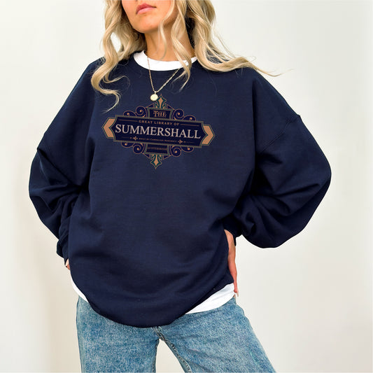 Navy Summershall Library sweatshirt with vintage-style lettering, worn by woman in jeans.