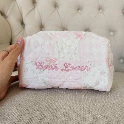 Book Lover Embroidered Quilted Cotton Makeup Bag | Bookish Pouch for Readers - The Bean Workshop - book girlie, bookish gift, bookish pouch, bow, coquette, coquette gift, embroidered makeup bag, gift for book lovers, kindle bag, makeup bag, quilted makeup bag, quilted pouch, read everyday, reading accessories, reading accessories bag