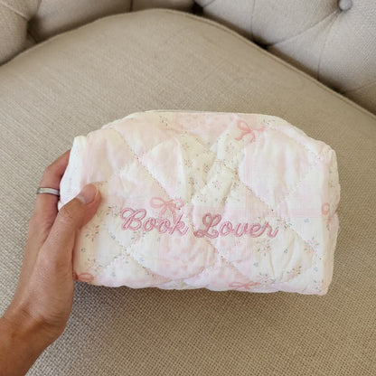 Book Lover Embroidered Quilted Cotton Makeup Bag | Bookish Pouch for Readers - The Bean Workshop - book girlie, bookish gift, bookish pouch, bow, coquette, coquette gift, embroidered makeup bag, gift for book lovers, kindle bag, makeup bag, quilted makeup bag, quilted pouch, read everyday, reading accessories, reading accessories bag