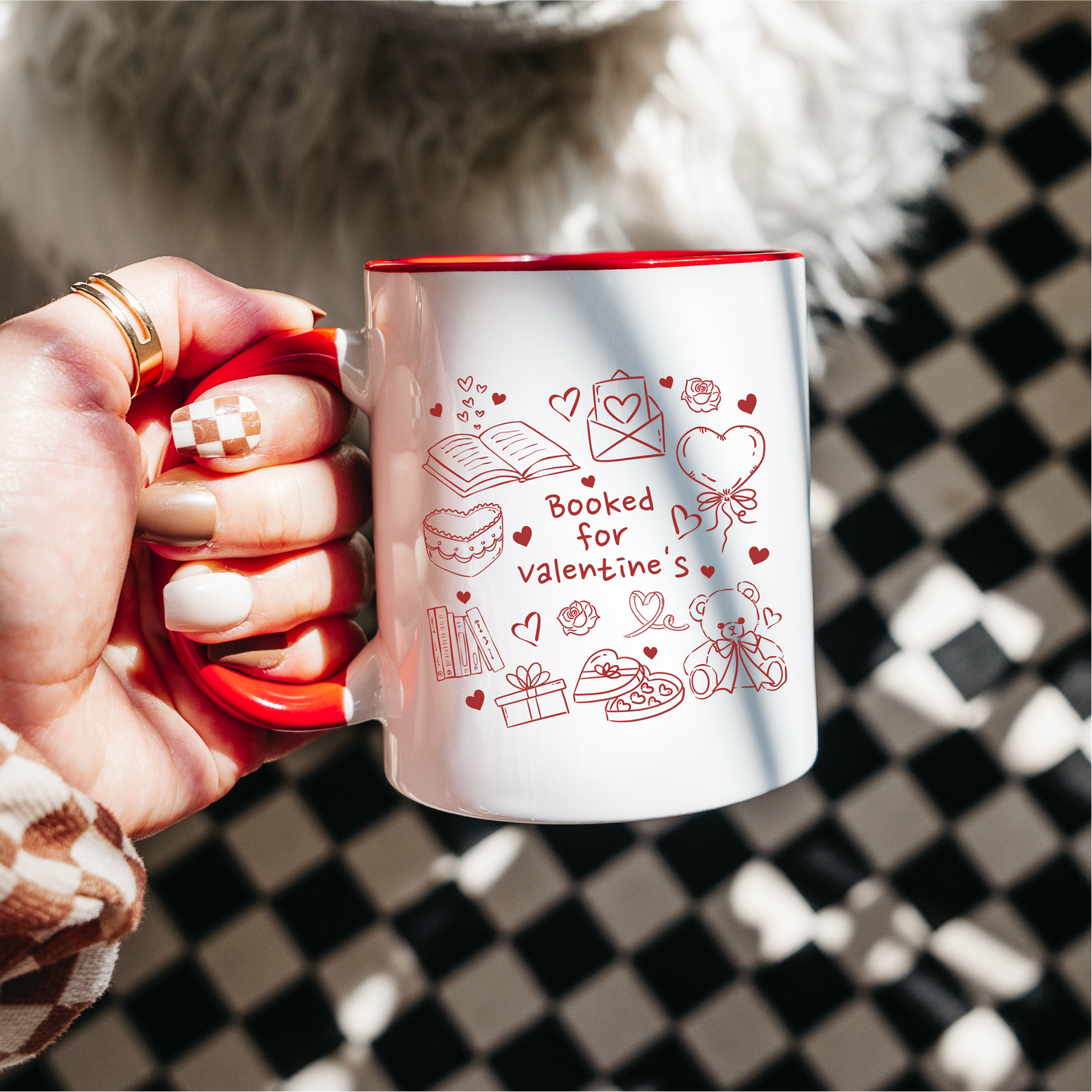 Hand holding white mug with red handle, 'Booked for valentine's' bookish doodles, Valentine's gift