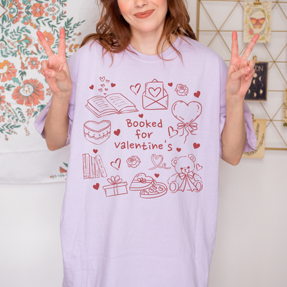Woman wearing lavender t-shirt with 'Booked for Valentine's' doodle, bookish Valentine design