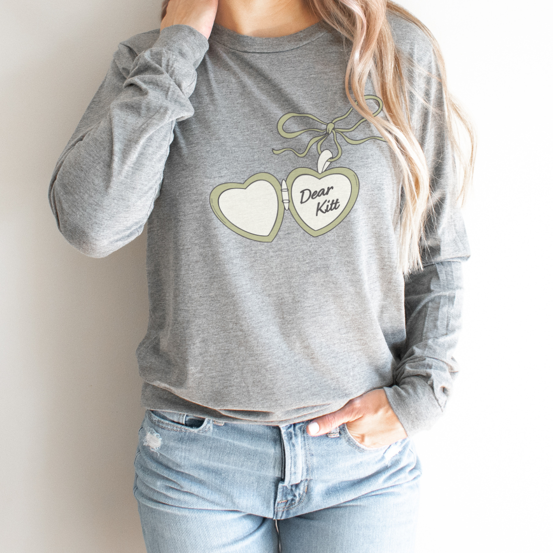 Dear Kitt Heart Locket Long Sleeve Tee | Divine Rivals Rebecca Ross Gift - The Bean Workshop - Book Lover Gift, Cottagecore, Cozy Aesthetic, Cute Book Merch, Dear Kitt apparel for readers, Divine Rivals, Iris Winnow, Letters of Enchantment, Letters of Enchantment book merch, long sleeve tee, Reader Apparel, Rebecca Ross, Roman Kitt, Romantic fantasy clothing, Vintage Locket