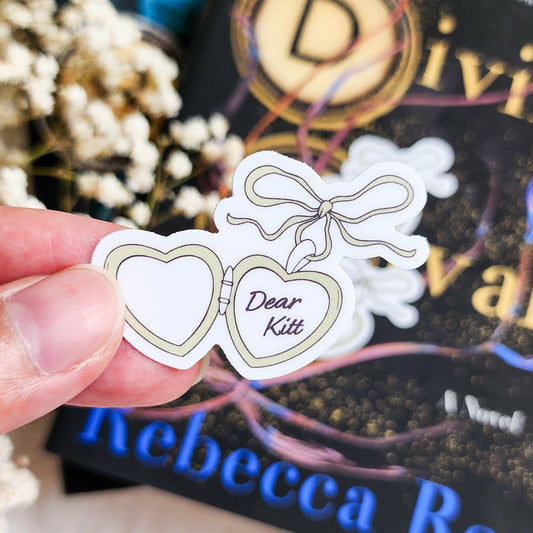 Dear Kitt Heart Locket Sticker | Divine Rivals Rebecca Ross - The Bean Workshop - bookish gift, bookish sticker, Dear Kitt, Divine Rivals, Divine Rivals merch, fantasy romance, gift for book lovers, Iris and Roman, journal sticker, laptop sticker, Letters of Enchantment, Rebecca Ross, Rebecca Ross fan merchandise, Rebecca Ross merch, Roman Kitt, Ruthless Vows, sticker