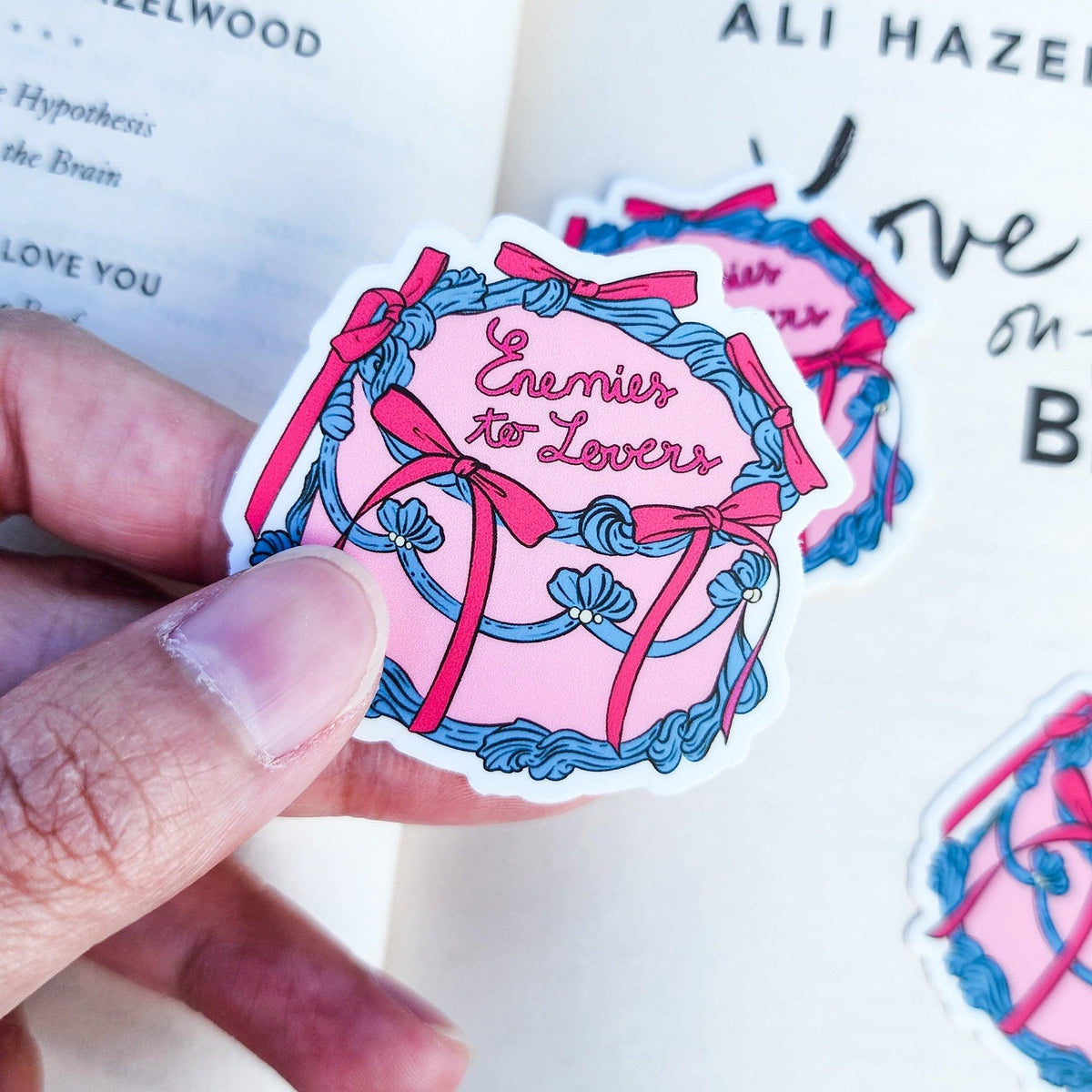 Enemies to Lovers Book Trope Retro Cake Sticker - The Bean Workshop - book lover gift, book trope, book trope sticker, Bookish Accessories, Bookish Gift, bookish sticker, coquette sticker, die cut sticker, enemies to lovers, kindle sticker, reading sticker, retro cake sticker, romance reader, sticker