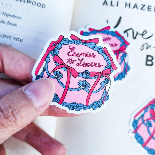 Enemies to Lovers Book Trope Retro Cake Sticker - The Bean Workshop - book lover gift, book trope, book trope sticker, Bookish Accessories, Bookish Gift, bookish sticker, coquette sticker, die cut sticker, enemies to lovers, kindle sticker, reading sticker, retro cake sticker, romance reader, sticker