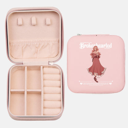 Pink jewelry travel case with character illustration and compartments for book lovers
