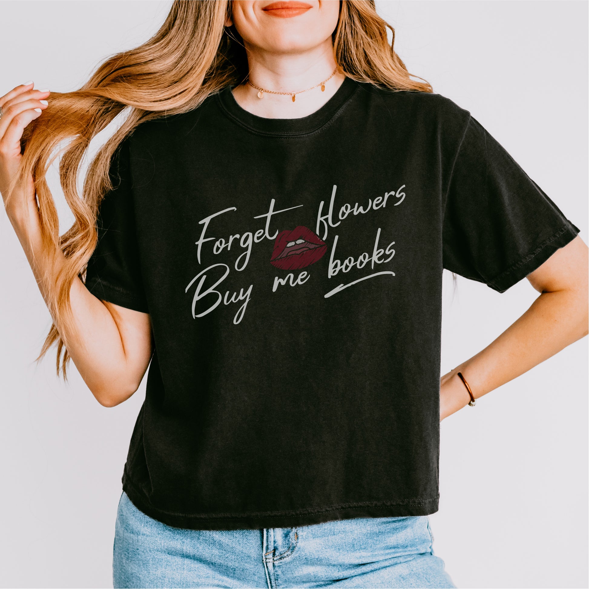 Woman wearing black tee with 'Forget flowers buy me books' and lips graphic, book lover shirt