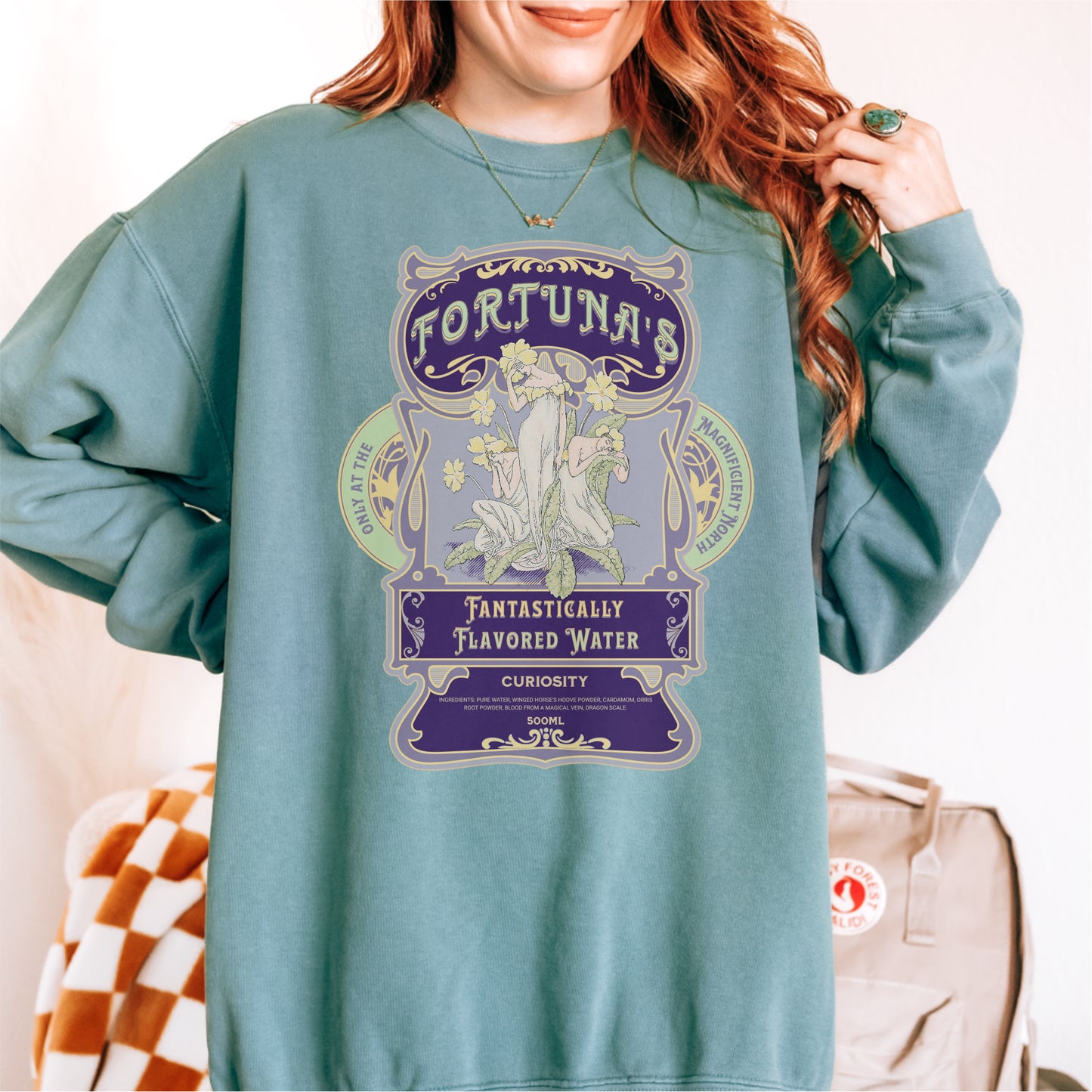 Green bookish sweatshirt with 'Fortuna's Fantastically Flavored Water' vintage-style design