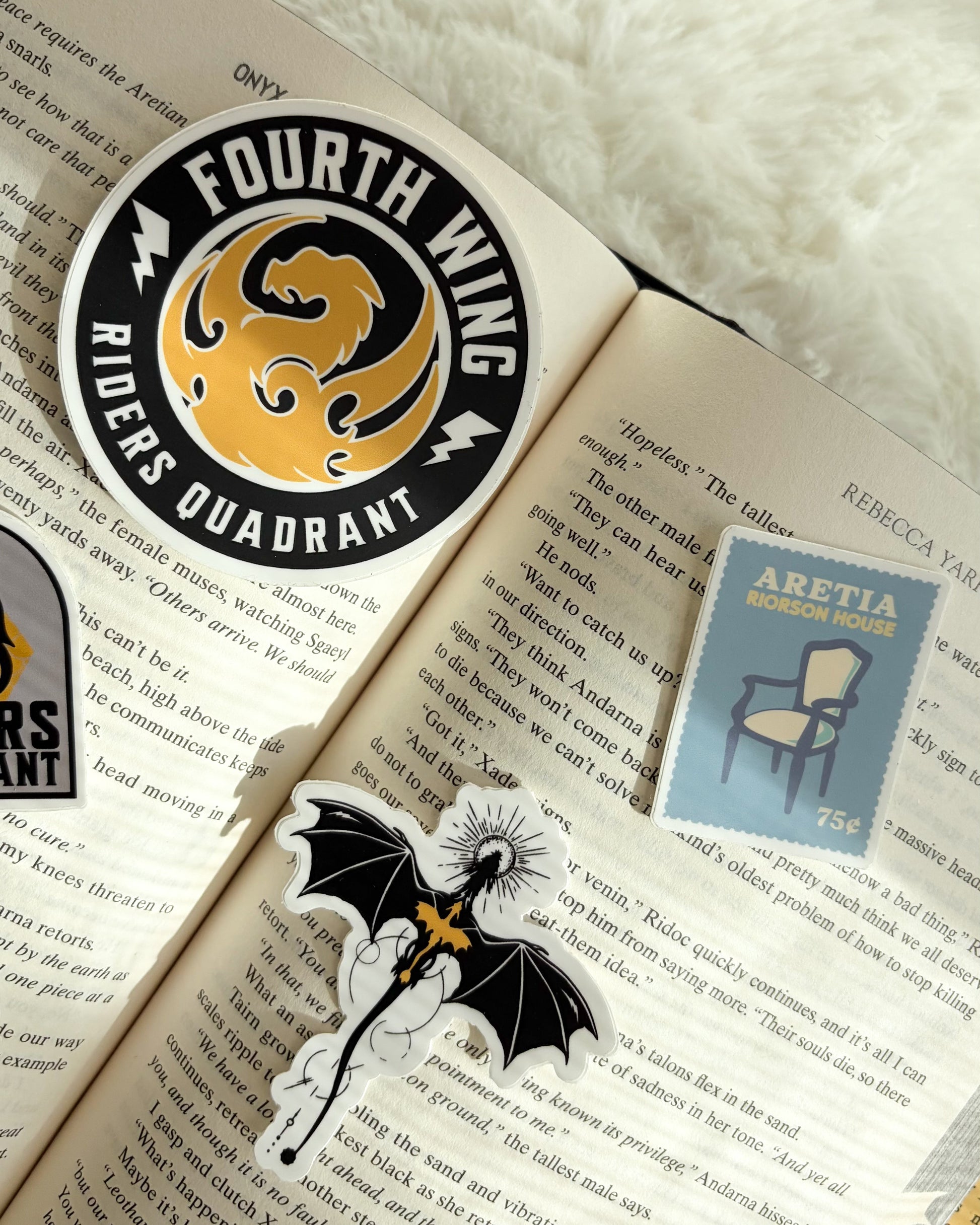 Stickers on an open book with a white fluffy background