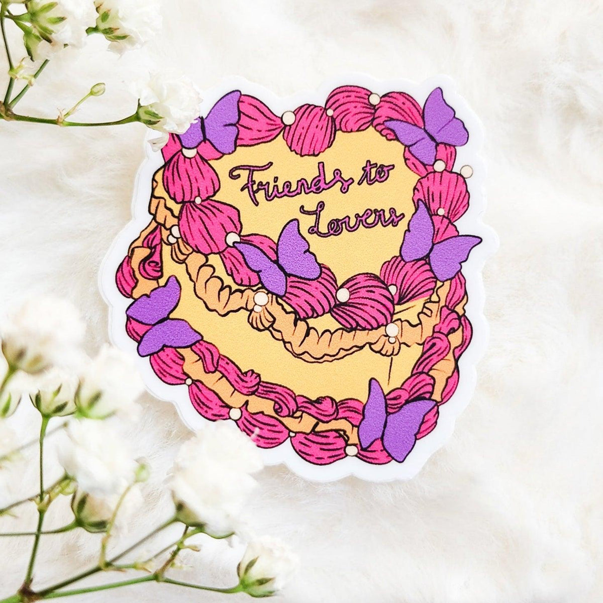 Friends to Lovers Book Trope Retro Cake Sticker - The Bean Workshop - book lover gift, book trope, book trope sticker, Bookish Accessories, Bookish Gift, bookish sticker, butterfly sticker, die cut sticker, friends to lovers, kindle sticker, reading sticker, retro cake sticker, romance reader, slow burn, sticker