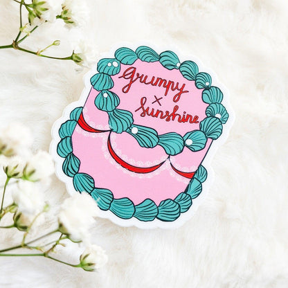 Grumpy x Sunshine Book Trope Retro Cake Sticker - The Bean Workshop - book lover gift, book trope, book trope sticker, Bookish Accessories, Bookish Gift, bookish sticker, coquette sticker, die cut sticker, grumpy sunshine, grumpy x sunshine, kindle sticker, reading sticker, retro cake sticker, romance reader, sticker
