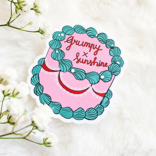 Grumpy x Sunshine Book Trope Retro Cake Sticker - The Bean Workshop - book lover gift, book trope, book trope sticker, Bookish Accessories, Bookish Gift, bookish sticker, coquette sticker, die cut sticker, grumpy sunshine, grumpy x sunshine, kindle sticker, reading sticker, retro cake sticker, romance reader, sticker