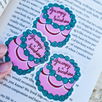 Grumpy x Sunshine Book Trope Retro Cake Sticker - The Bean Workshop - book lover gift, book trope, book trope sticker, Bookish Accessories, Bookish Gift, bookish sticker, coquette sticker, die cut sticker, grumpy sunshine, grumpy x sunshine, kindle sticker, reading sticker, retro cake sticker, romance reader, sticker