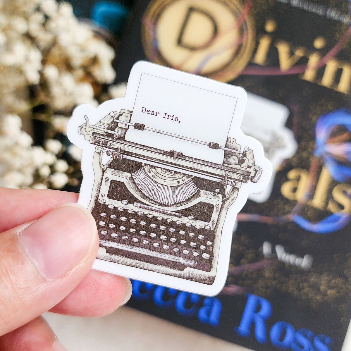 Iris Winnow Allouette Typewriter Sticker | Divine Rivals Rebecca Ross - The Bean Workshop - bookish gift, bookish sticker, Divine Rivals, Divine Rivals merch, fantasy romance, gift for book lovers, Iris and Roman, Iris Winnow, journal sticker, laptop sticker, Letters of Enchantment, Rebecca Ross, Rebecca Ross merch, Ruthless Vows, sticker, typewriter sticker