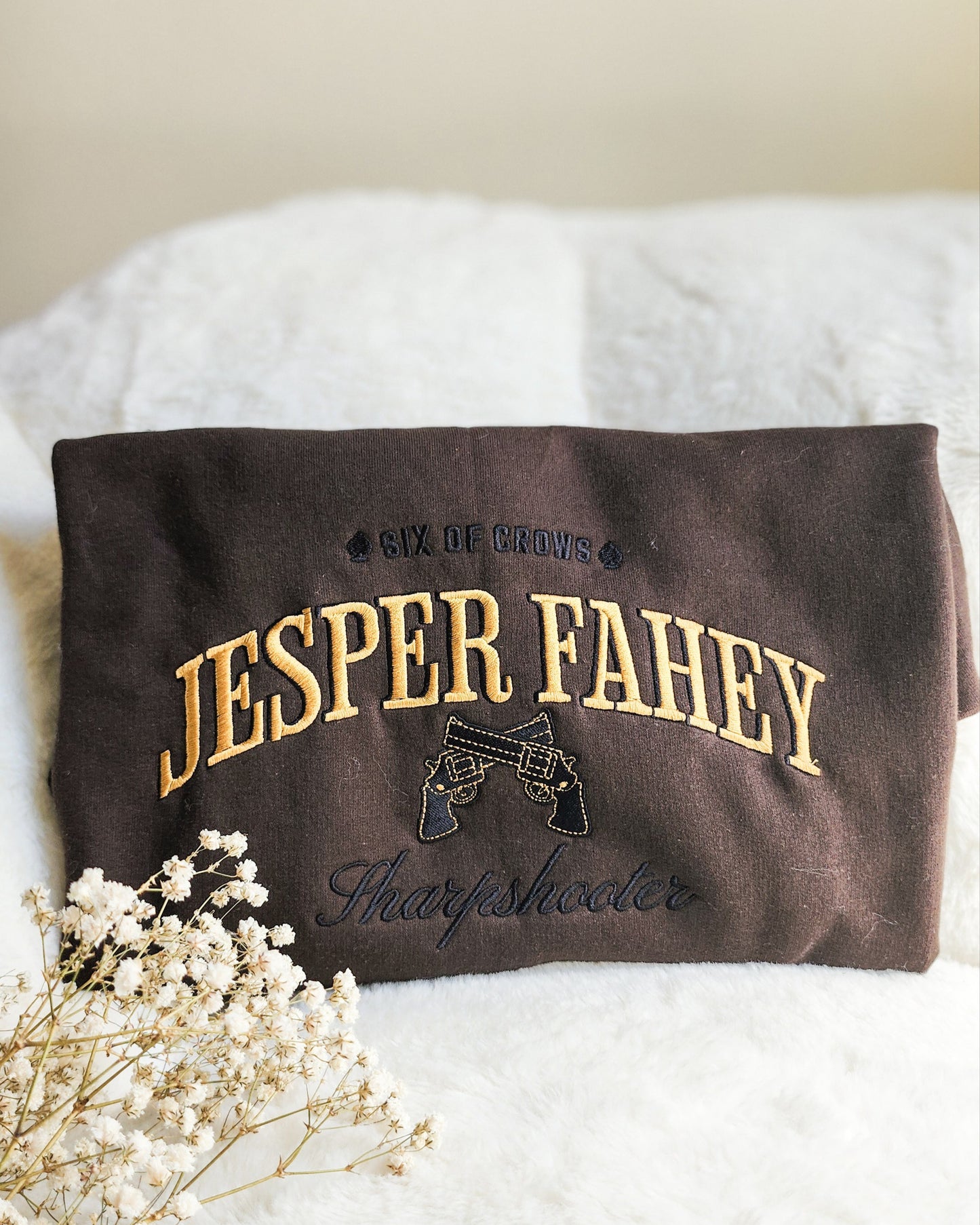 Jesper Fahey Embroidered Sweatshirt - The Bean Workshop - Book Lover Gift, Bookish Sweatshirt, Fantasy Gunslinger, Grishaverse clothing, Jesper Fahey embroidered sweatshirt, Ketterdam, Leigh Bardugo fan apparel for readers, LGBTQ Character, Revolver Embroidery, Six of Crows sharpshooter merch, The Dregs, Wesper, Zemeni