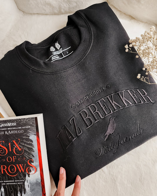 Kaz Brekker Embroidered Sweatshirt - The Bean Workshop - Bookish Gift, Bookworm Apparel, Crow Club, Dark Fantasy, Dirtyhands, Grishaverse sweatshirt, Kaz Brekker embroidered sweatshirt, Ketterdam, Leigh Bardugo fan apparel for readers, Literary Character, Minimalist Aesthetic, Six of Crows minimalist merch, The Dregs