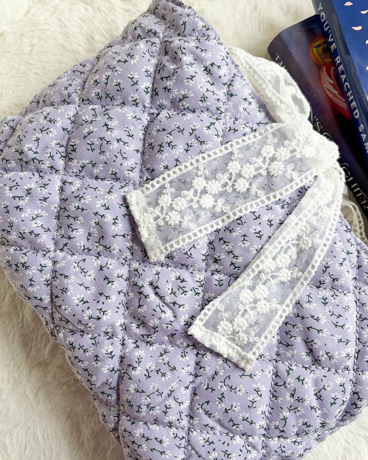 Lavender Quilted Book Sleeve with Lace Ribbon | Bible, Hardcover & Laptop Sleeve - The Bean Workshop - Bible cover, Bible sleeve, book girlie, book sleeve, bookish, bookish gifts, Christian gifts, church bag, coquette, cottagecore, dreamy, floral, floral book sleeve, flower, gift for book lovers, gift for women, girl summer, lace, lavender, lavender book sleeve, purple, quilted, reading accessories, soft girl, study Bible cover, study Bible sleeve