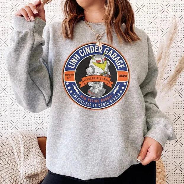 Linh Cinder Garage Sweatshirt - The Bean Workshop - marissa meyer, sweatshirt, tlc
