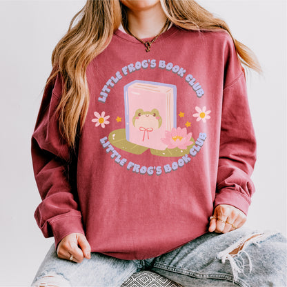 Burgundy sweatshirt with frog and book graphic, floral accents, and 'Little Frog's Book Club' text