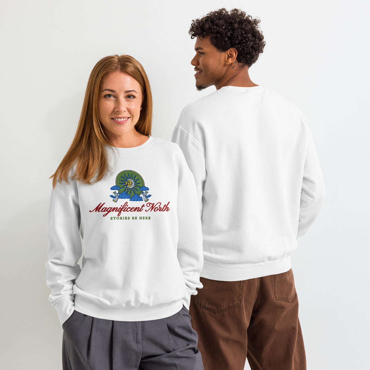 Magnificent North Embroidered Fleece Sweatshirt - The Bean Workshop - Cherub Trumpeter Detail, Cozy Loungewear, Embroidered Fleece Sweatshirt, Magnificent North Embroidered Fleece Sweatshirt for Book Lovers, Olive and Gold Color Palette, Once Upon a Broken Heart, Once Upon a Broken Heart Fan Gift, Stephanie Garber, Storybook Emblem, Sun and Moon Illustration, Travel Day Comfort, Whimsical Celestial