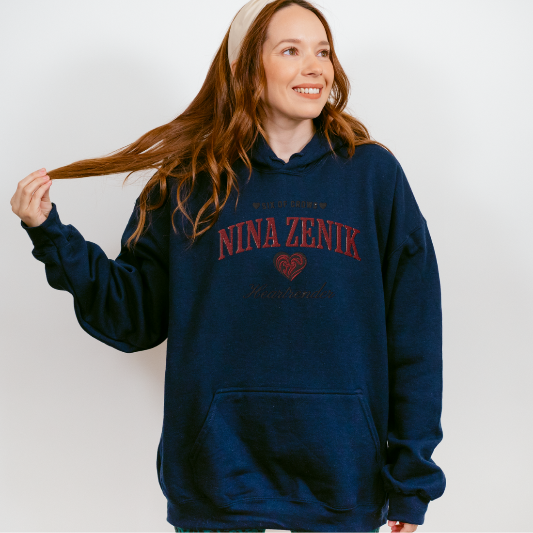 Nina Zenik Embroidered Hoodie - The Bean Workshop - Bookworm Hoodie, Fandom Apparel, Fantasy Character, Grisha Power, Grishaverse gift, Heart Design, Heartrender fan merchandise, Helnik, Leigh Bardugo fan apparel for readers, Literary Streetwear, Nina Zenik embroidered hoodie, Six of Crows hooded sweatshirt, The Dregs apparel