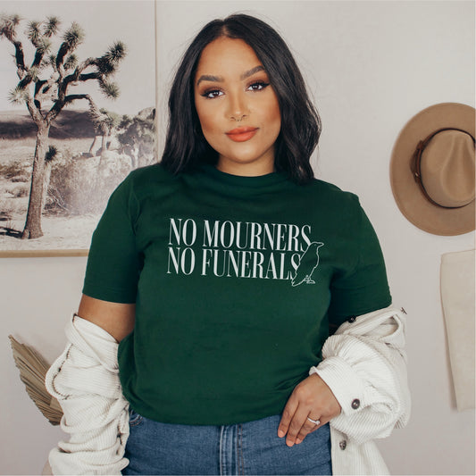 No Mourners No Funerals T-Shirt - The Bean Workshop - Book lover gift, Bookish Apparel, Dark Fantasy, Fantasy Book Shirt., Kaz Brekker quote tee, Ketterdam, Leigh Bardugo fan merchandise, Literary Quote, Minimalist Aesthetic, No Mourners No Funerals t-shirt, Six of Crows quote shirt for readers, The Crows T-shirt, The Dregs
