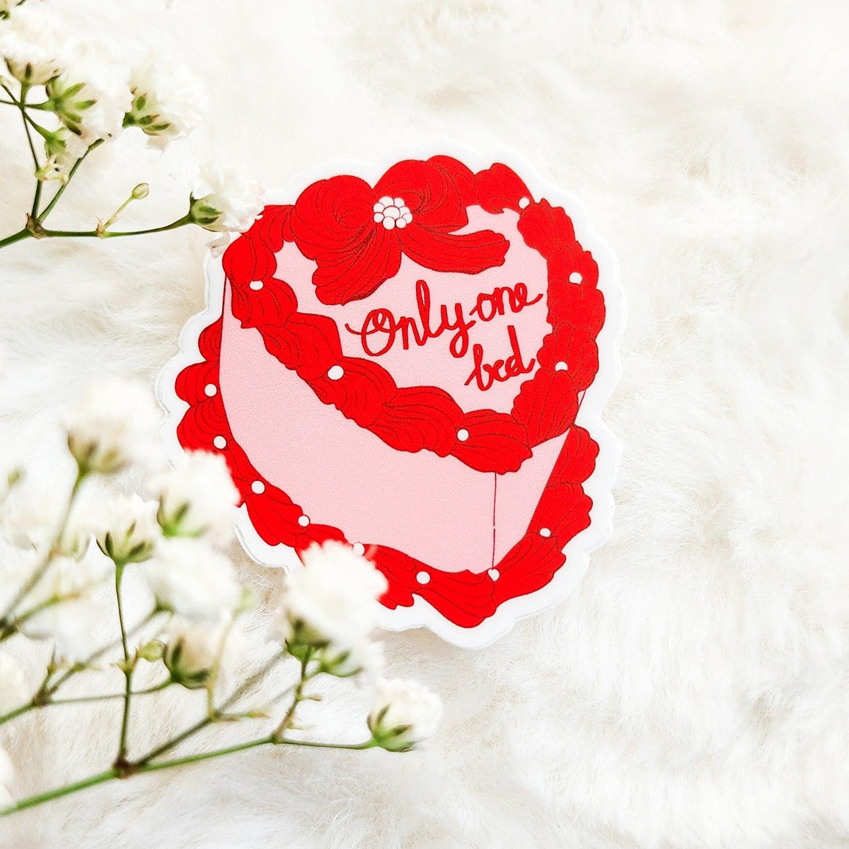 Only One Bed Book Trope Retro Cake Sticker - The Bean Workshop - book lover gift, book trope, book trope sticker, Bookish Accessories, Bookish Gift, bookish sticker, coquette sticker, die cut sticker, kindle sticker, only one bed, reading sticker, retro cake sticker, romance reader, romance trope, sticker