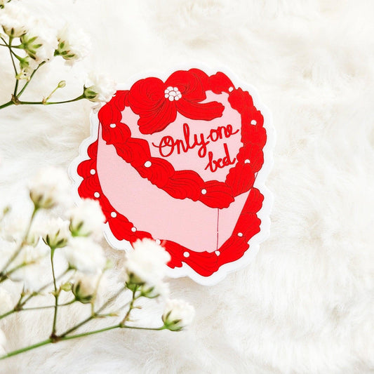 Only One Bed Book Trope Retro Cake Sticker - The Bean Workshop - book lover gift, book trope, book trope sticker, Bookish Accessories, Bookish Gift, bookish sticker, coquette sticker, die cut sticker, kindle sticker, only one bed, reading sticker, retro cake sticker, romance reader, romance trope, sticker