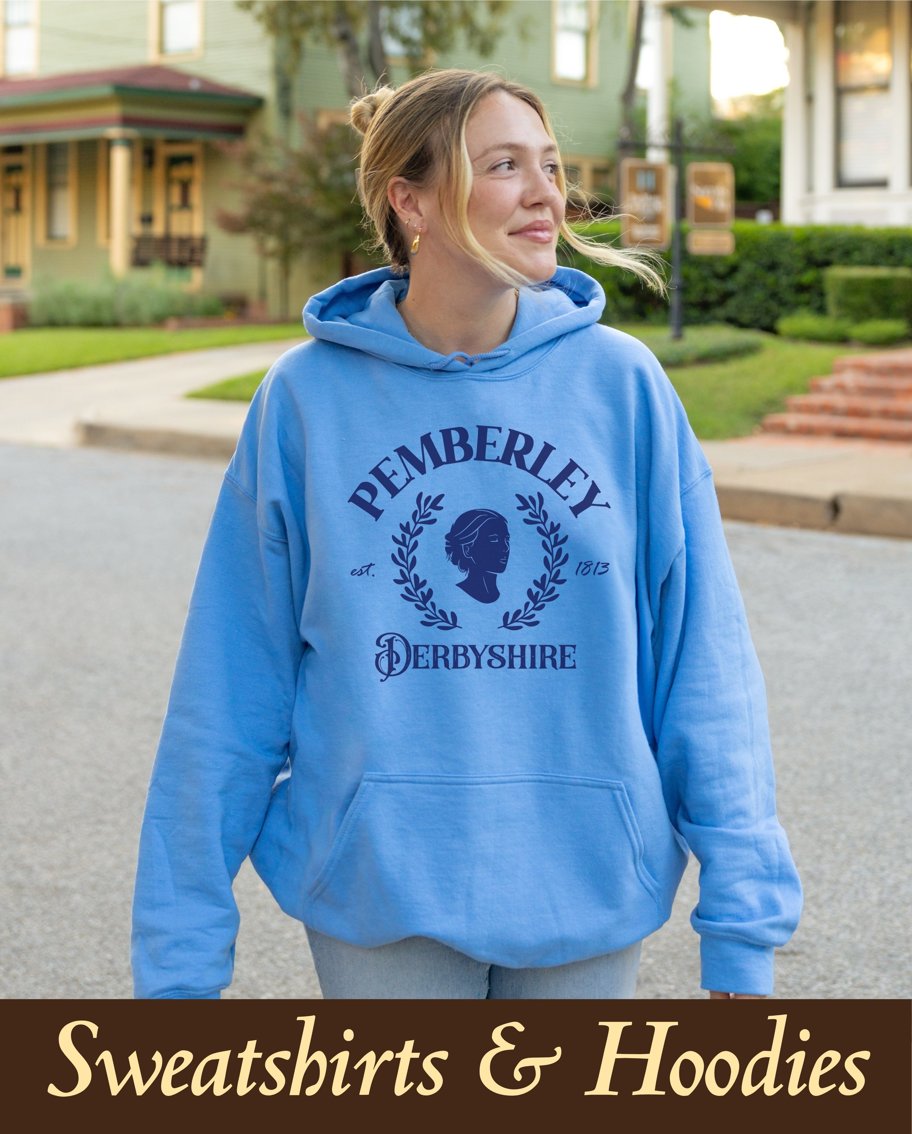 An elegant, premium collegiate Pemberley Derbyshire bookish hoodie styled naturally outdoors, perfect for a cozy autumn classic literature uniform or a wholesome campus reading lifestyle outfit.