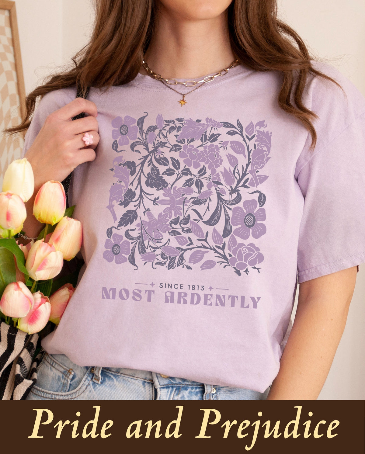 A wholesome, premium literary apparel t-shirt showcasing Jane Austen's classic Pride and Prejudice quote, styled naturally with light-wash jeans and a bouquet of tulips for a cozy autumn cottagecore wardrobe.