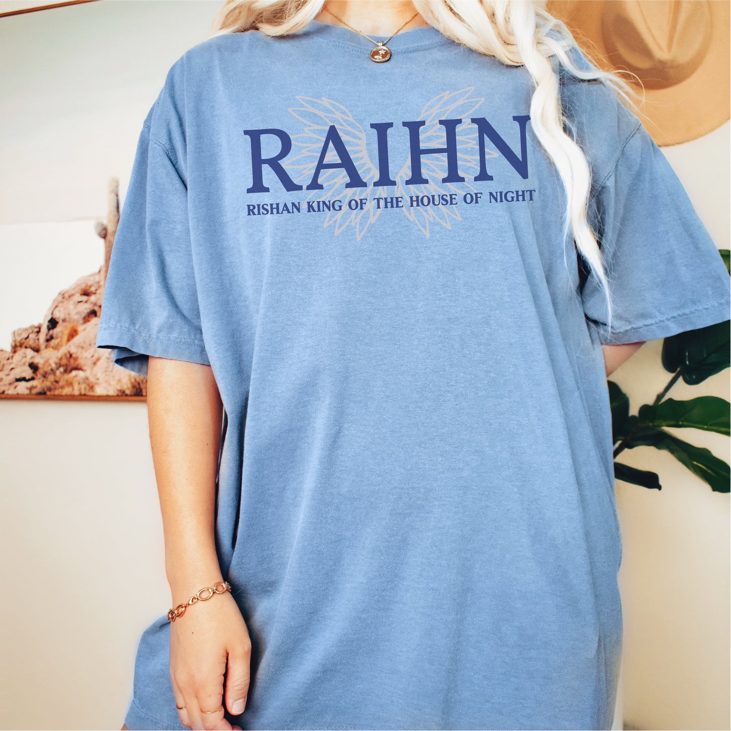 Light blue oversized t-shirt with 'RAIHN Rishan King of the House of Night' bookish design