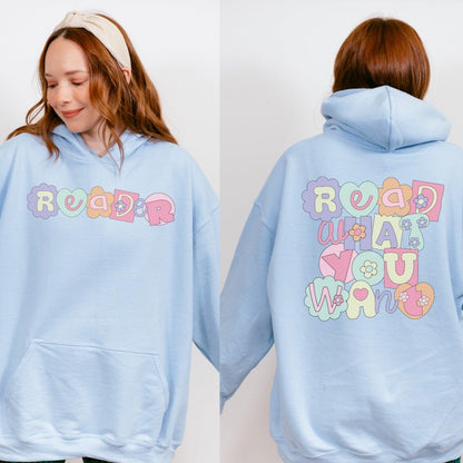 Light blue hoodie with colorful 'reader' on front and 'read what you want' on back, floral design.