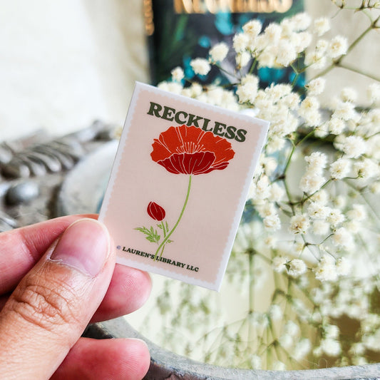 Reckless Lauren Roberts Stamp Sticker - The Bean Workshop - book lover gift, Bookish Accessories, Bookish Gift, bookish sticker, die cut sticker, fantasy romance sticker, kai azer, kindle sticker, lauren roberts, Lauren Roberts merch, paedyn gray, powerless, Powerless merch, reckless, Reckless merch, stamp sticker, sticker
