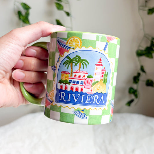 Riviera Green Checkered Ceramic Mug - The Bean Workshop - aesthetic mug, bookish gifts, bookish mug, ceramic mug, checkered mug, coastal grandmother, cocktail illustration, coffee mug, cottagecore, desk accessories, French Riviera, gifts for her, green handle mug, green mug, lighthouse, mug, palm tree, preppy, reader gifts, Riviera mug, tea mug