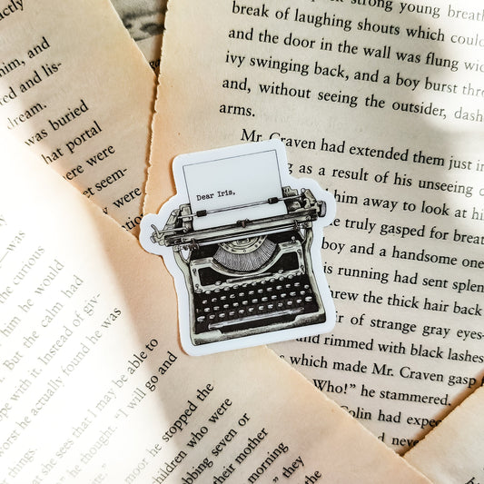 Roman Kitt Allouette Typewriter Sticker | Divine Rivals by Rebecca Ross - The Bean Workshop - bookish gift, bookish sticker, Divine Rivals, Divine Rivals merch, fantasy romance, gift for book lovers, Iris and Roman, journal sticker, laptop sticker, Letters of Enchantment, Rebecca Ross, Rebecca Ross merch, Roman Kitt, Ruthless Vows, sticker, typewriter sticker