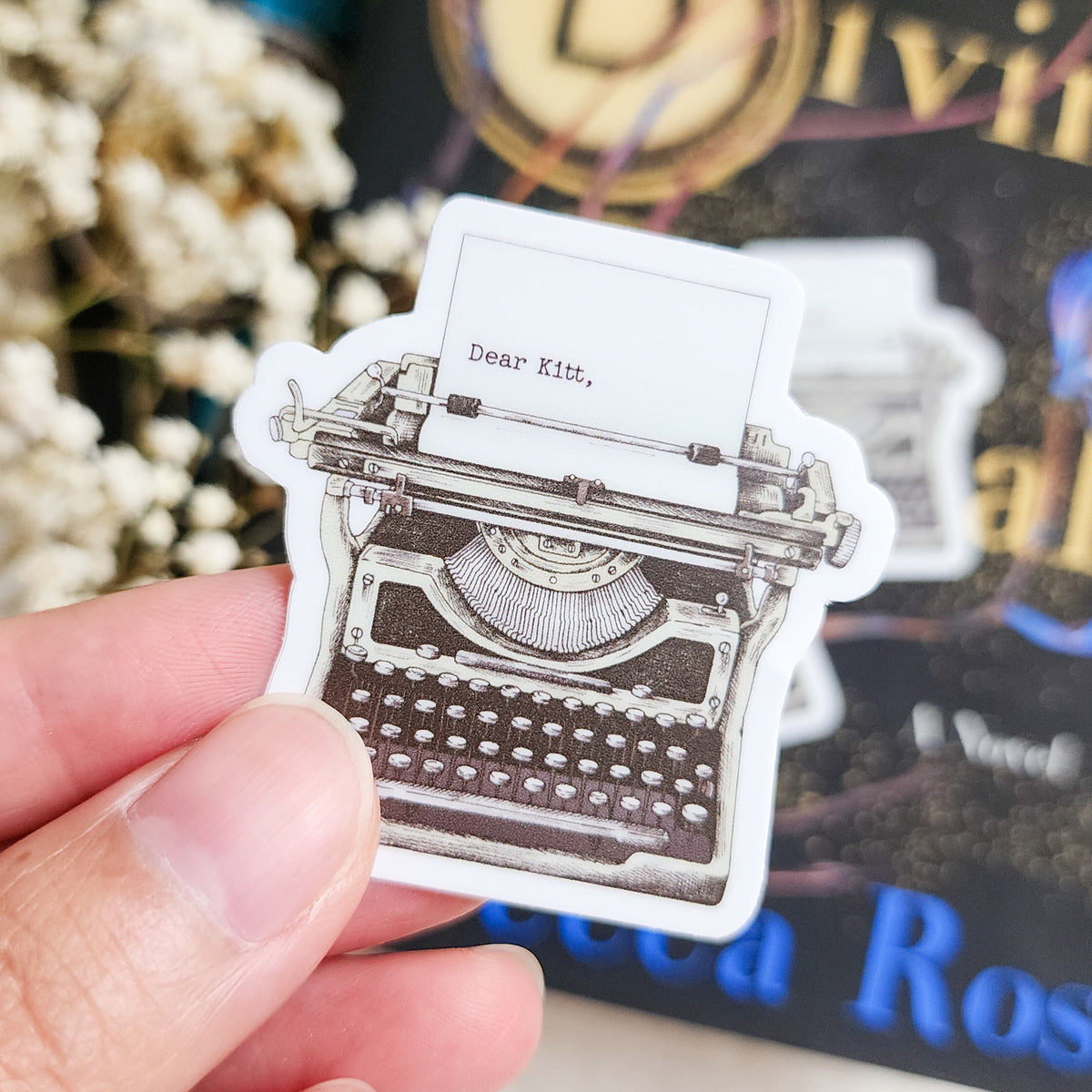 Roman Kitt Allouette Typewriter Sticker | Divine Rivals by Rebecca Ross - The Bean Workshop - bookish gift, bookish sticker, Divine Rivals, Divine Rivals merch, fantasy romance, gift for book lovers, Iris and Roman, journal sticker, laptop sticker, Letters of Enchantment, Rebecca Ross, Rebecca Ross merch, Roman Kitt, Ruthless Vows, sticker, typewriter sticker