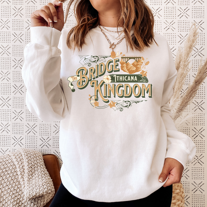 Woman wearing The Bridge Kingdom Ithicana art deco sweatshirt, cozy bookish loungewear